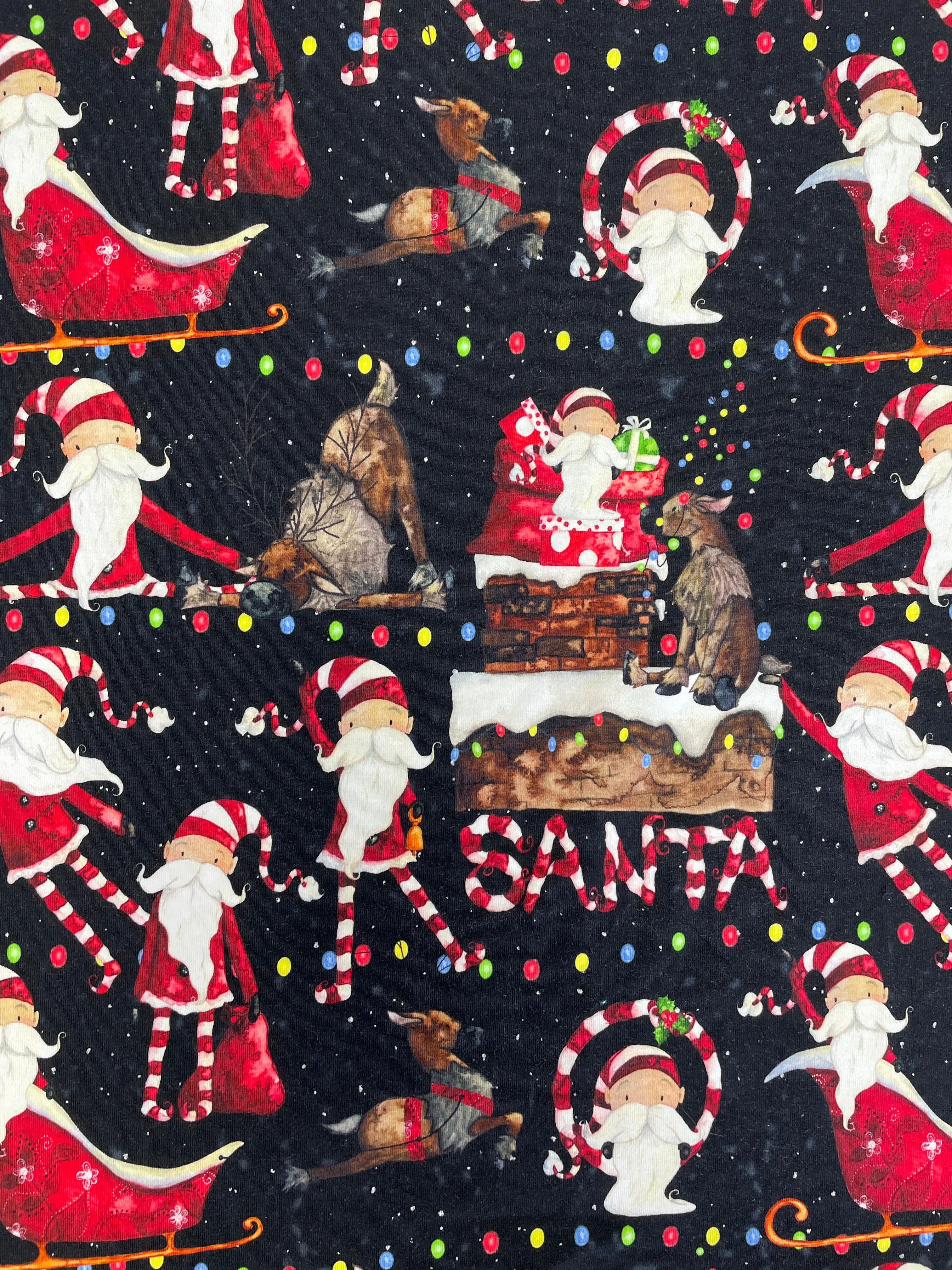 SALE 5/8 YD Cotton/Spandex Remnant - Black with Whimsical Santas & Reindeer